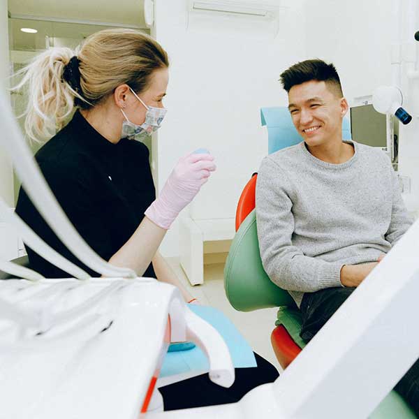 Oral surgery patient consulting with their surgeon